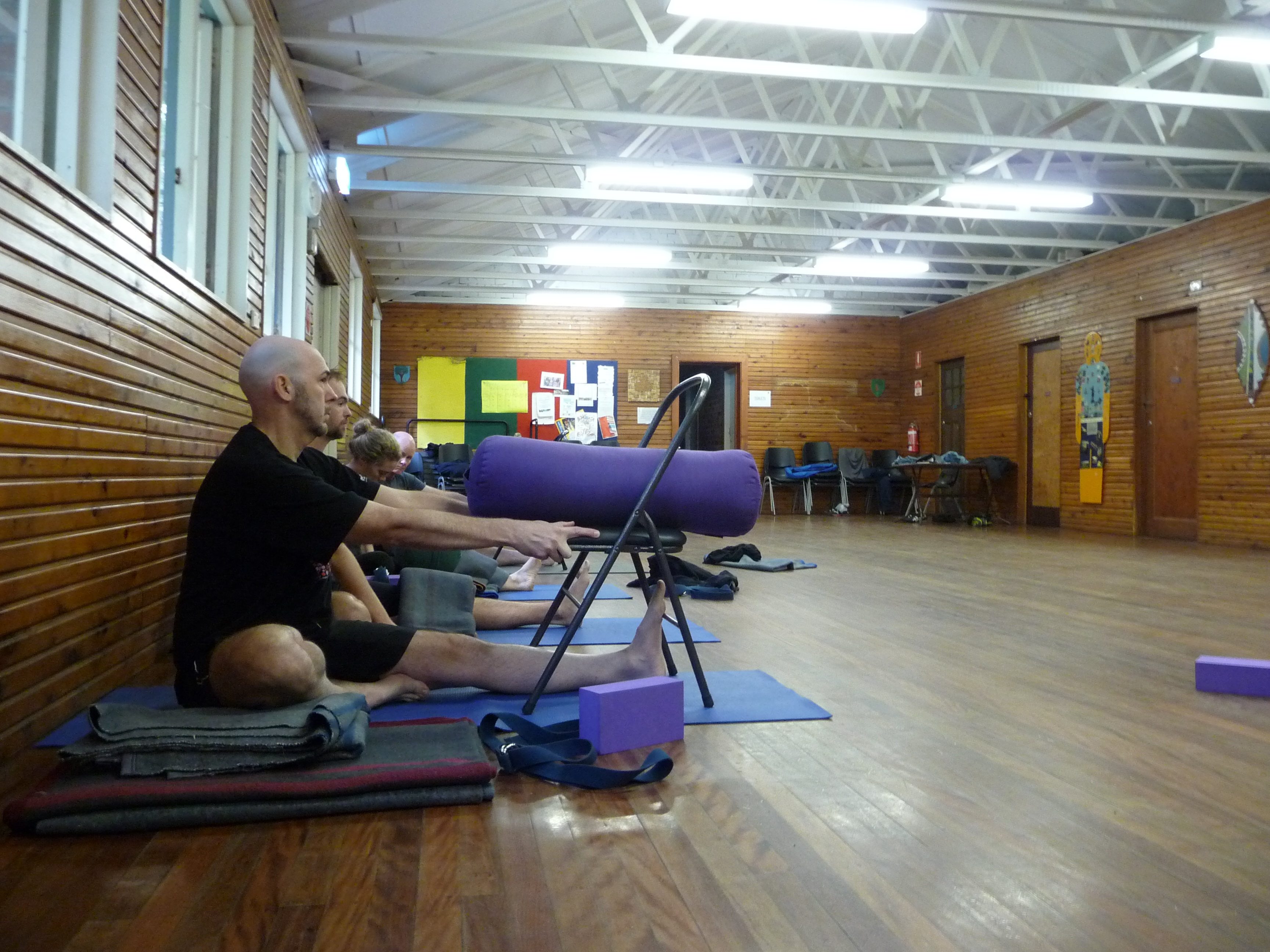 Students practising with chairs and props